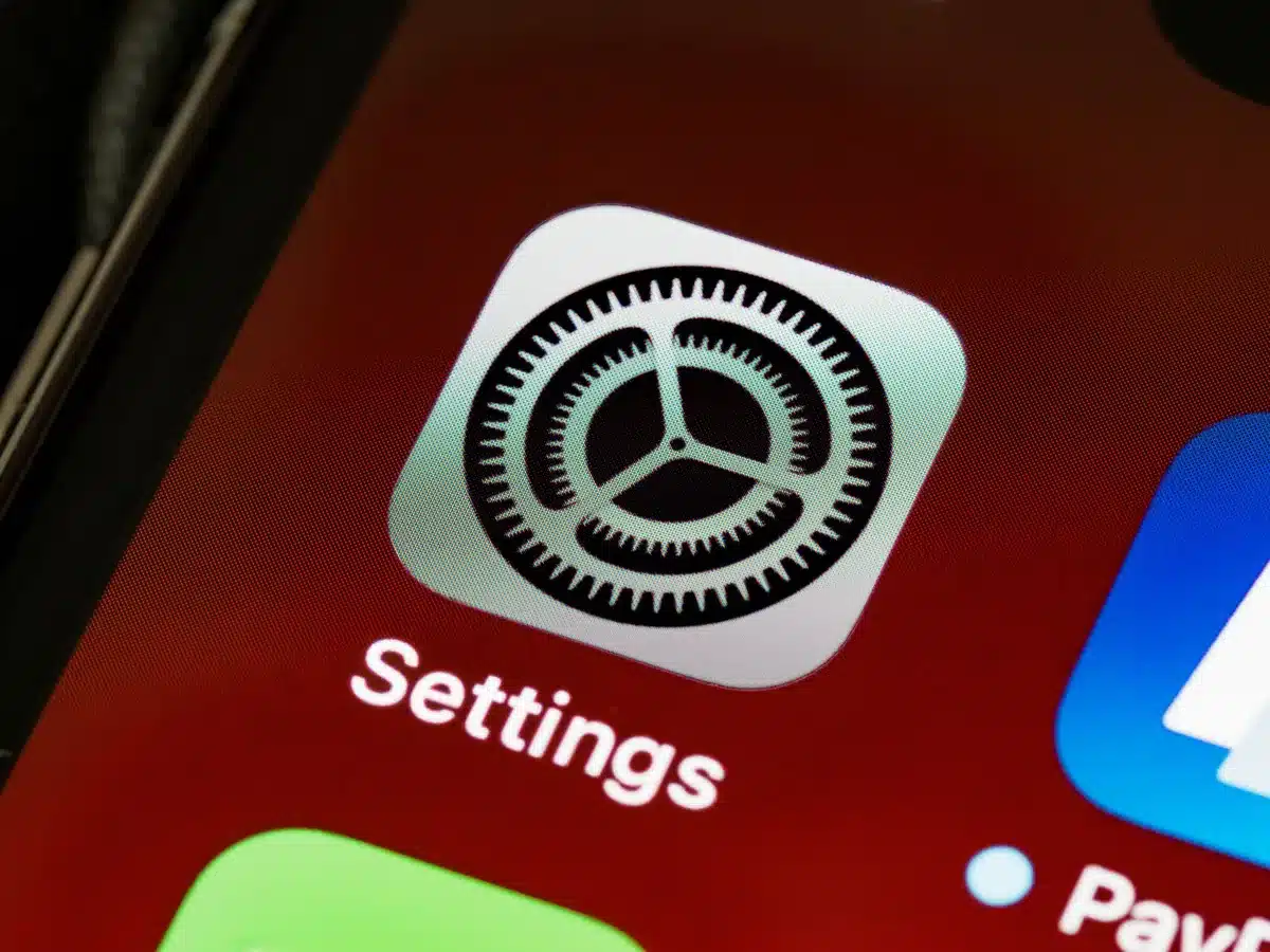Close-up of anonymous hands holding an unbranded phone with a settings screen showing performance options