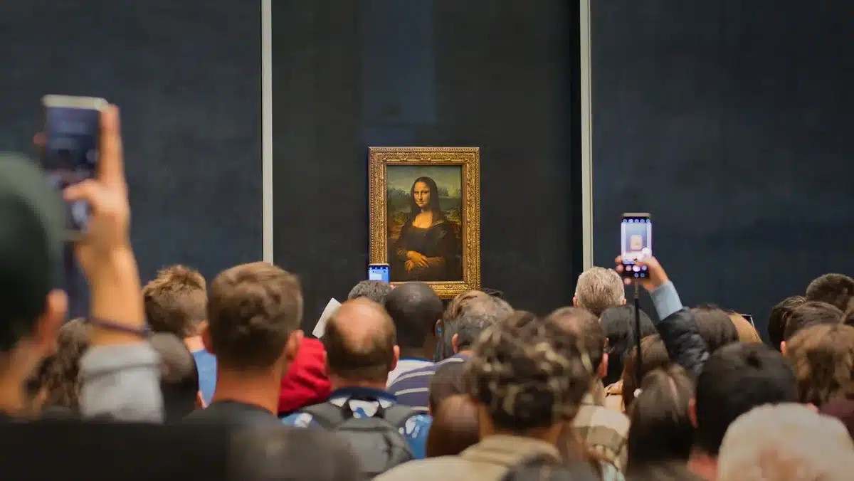anonymous crowd of people holding up generic smartphones in motion blur, stadium-like lighting