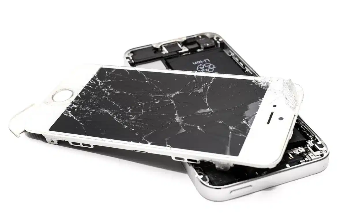 close-up of anonymous hands opening a tablet back panel, small screws visible, no brands