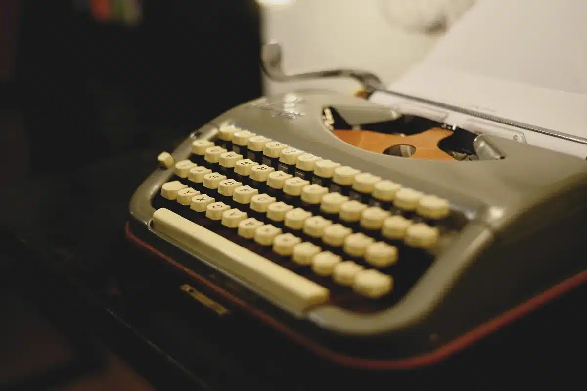 Anonymous close-up of an unbranded mechanical keyboard on discounted shelf tag, warm shop lighting