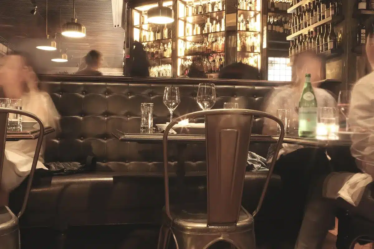 Close-up of chair fabric and faux-leather seam, emphasis on material contrast and stitching, no logos or brand marks