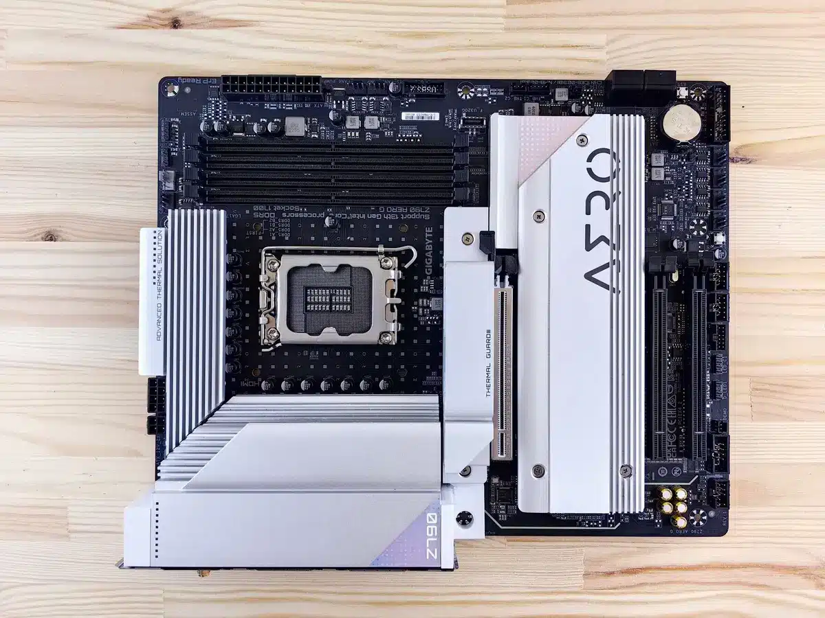Empty desktop workspace with an anonymous motherboard and CPU socket, boxed cooler and screwdriver nearby