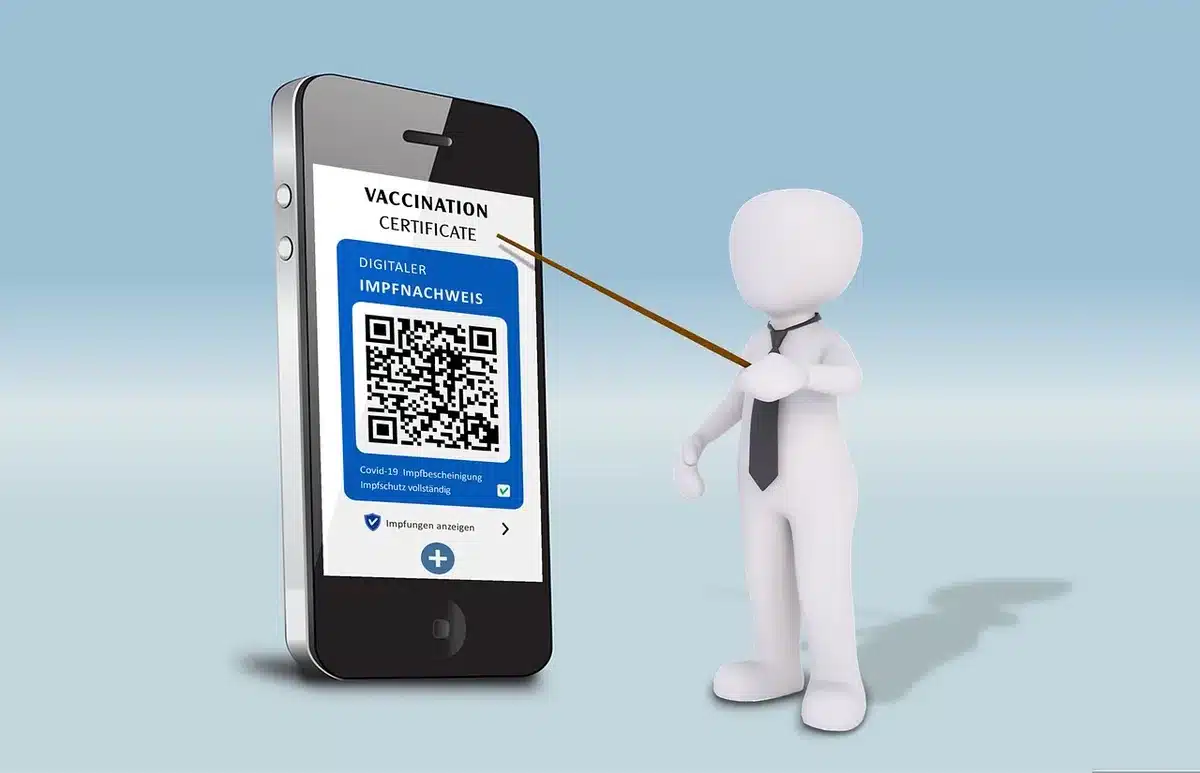 Anonymous hands holding a modern smartphone showing a blurred app gallery of cards, a bright animated booster pack icon visible on screen