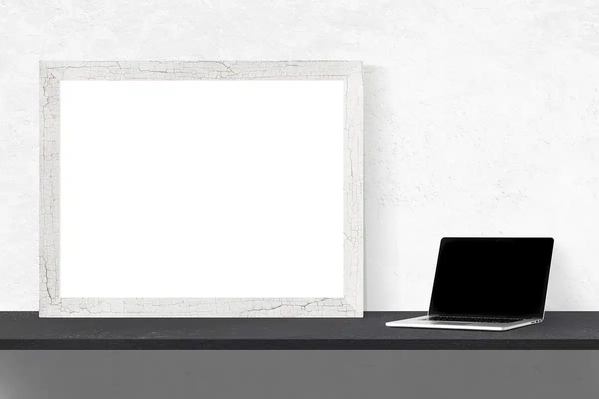 Empty electronics store shelf with assorted boxed laptop and peripheral packages on display, no brands visible
