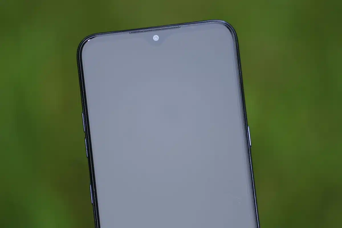 Empty winner's podium on a generic retail display with a single smartphone-shaped placeholder; soft studio lighting, no logos