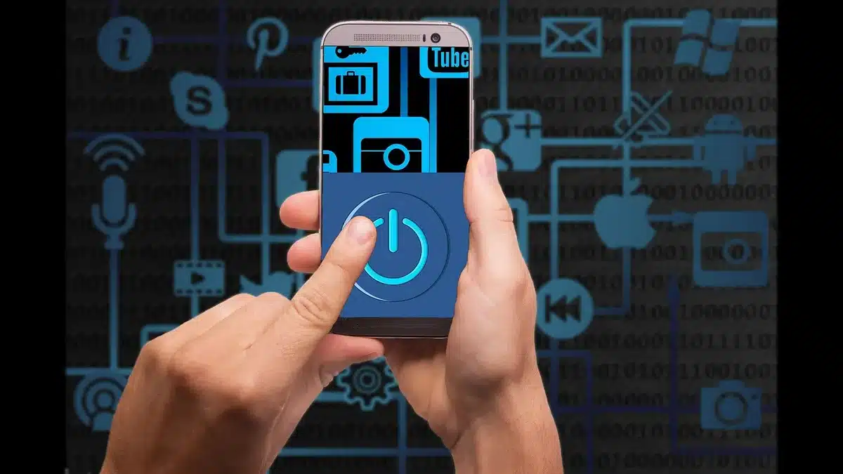 Close-up of an anonymous hand holding a smartphone showing a browser menu with 'aA' highlighted on screen; no brand or identifiable person